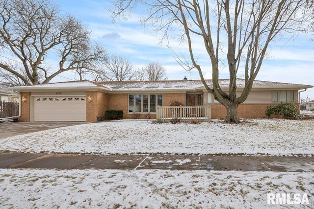 single story home with a garage