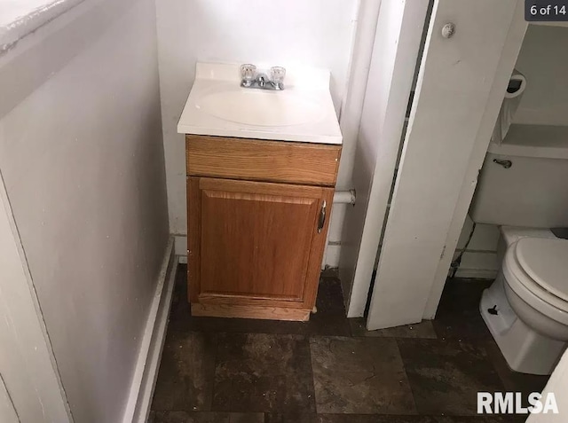 bathroom with vanity and toilet