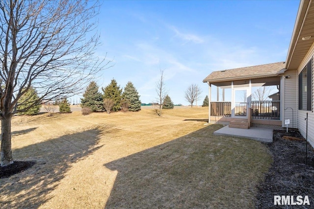 view of yard with a sunroom