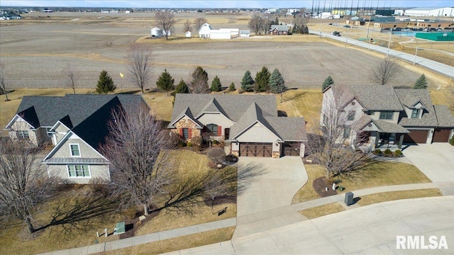 birds eye view of property with a residential view