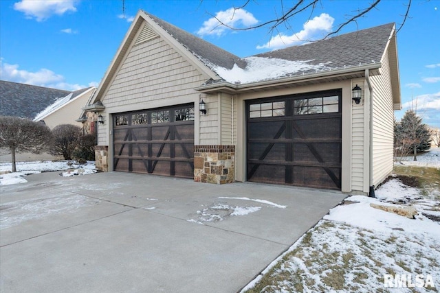 view of snow covered garage