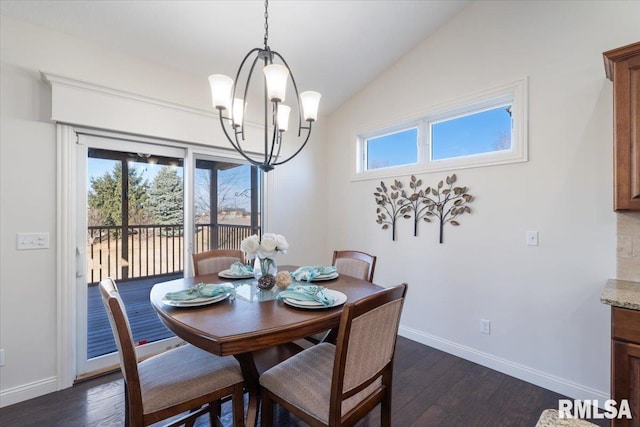 dining space featuring vaulted ceiling, baseboards, dark wood-style flooring, and a chandelier