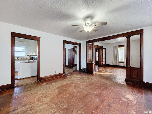 spare room with ceiling fan and hardwood / wood-style floors