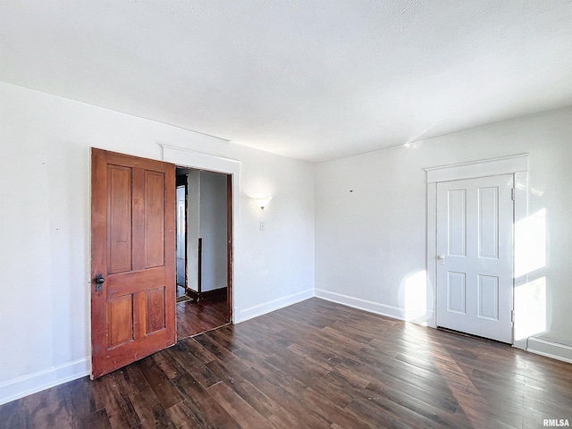 spare room featuring dark hardwood / wood-style floors