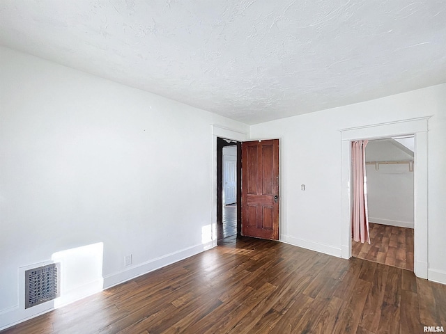 interior space featuring dark hardwood / wood-style floors and a closet