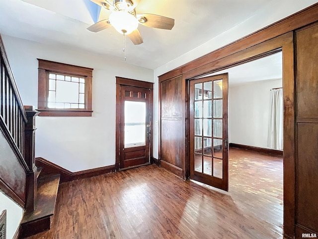 foyer entrance featuring ceiling fan and wood-type flooring