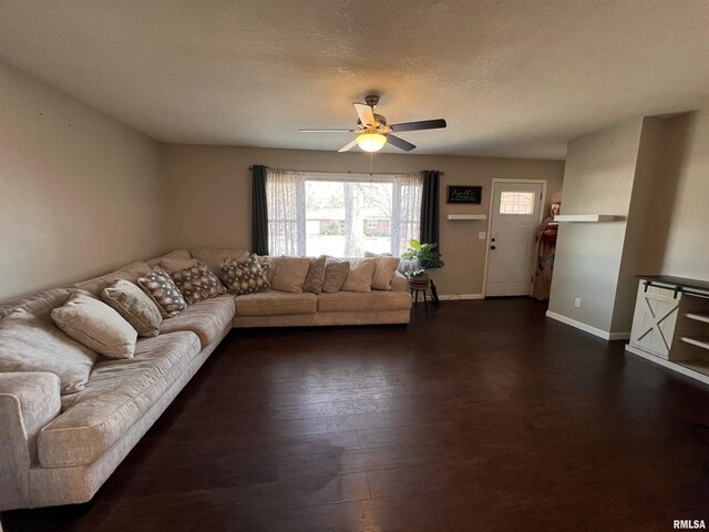 living room with ceiling fan and hardwood / wood-style flooring