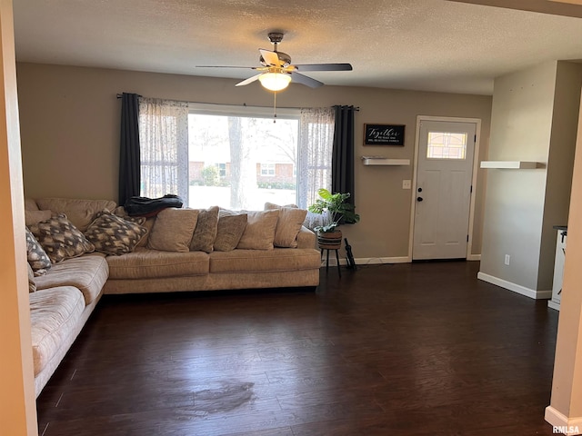 2433 Cedar Creek Ct, Quincy, IL 62305 - unfurnished living room with ceiling fan, dark hardwood / wood-style floors, and a textured ceiling