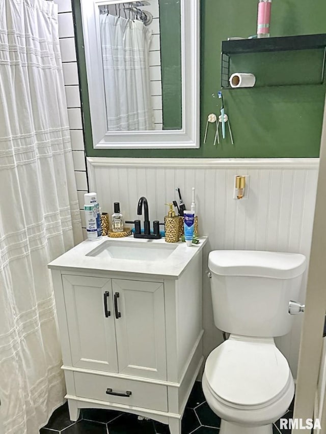 2433 Cedar Creek Ct, Quincy, IL 62305 - bathroom with vanity, a shower with curtain, tile patterned floors, and toilet