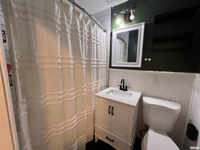2433 Cedar Creek Ct, Quincy, IL 62305 - bathroom featuring vanity, a textured ceiling, and toilet