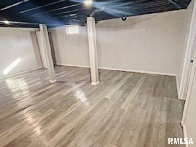 bedroom with wood-type flooring