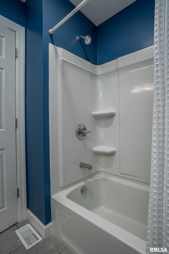 bathroom with tile patterned floors and shower / bathtub combination with curtain