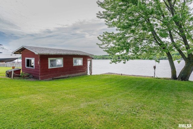 exterior space featuring a yard and a water view