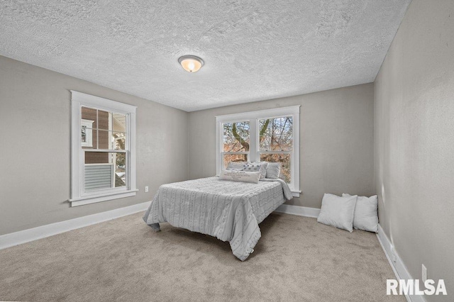 carpeted bedroom with a textured ceiling