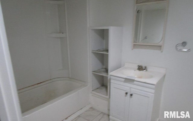 full bath featuring marble finish floor and vanity