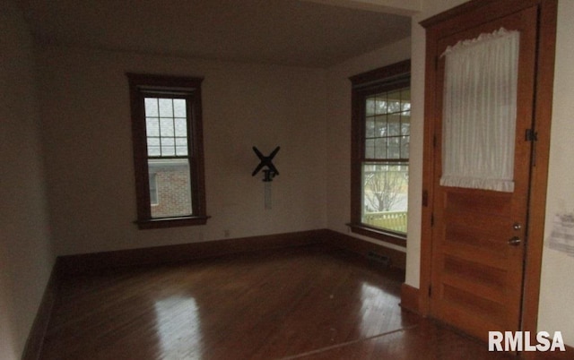 unfurnished room featuring wood finished floors