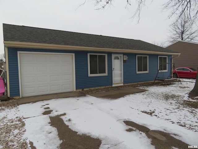 ranch-style house featuring a garage