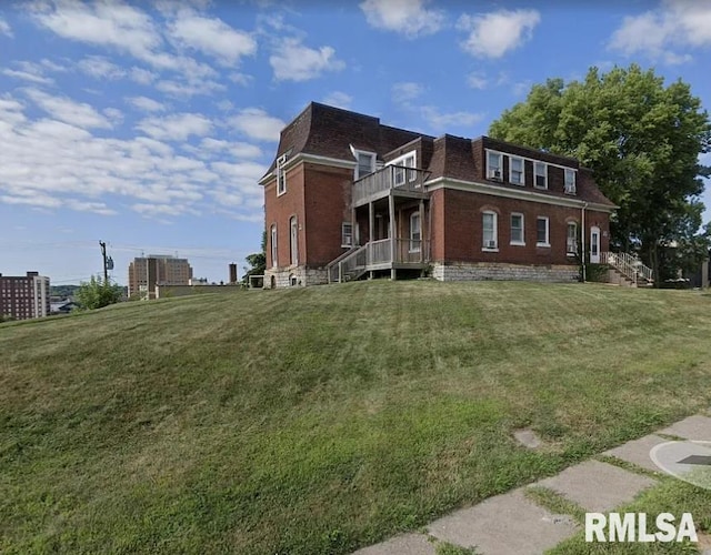 view of property exterior featuring a yard and a balcony