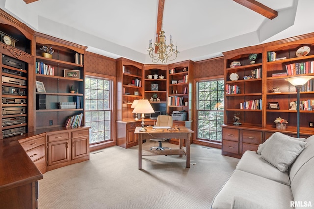 carpeted office space featuring plenty of natural light, beam ceiling, and an inviting chandelier