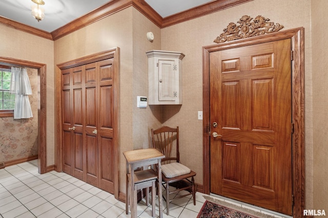 foyer with light tile patterned floors and crown molding