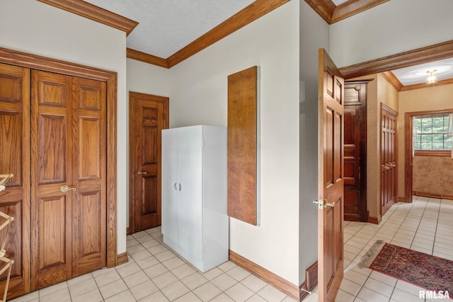 interior space with crown molding and light tile patterned floors