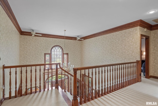 hall with carpet and ornamental molding