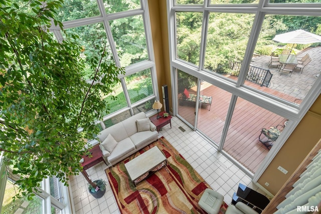 sunroom / solarium featuring a healthy amount of sunlight