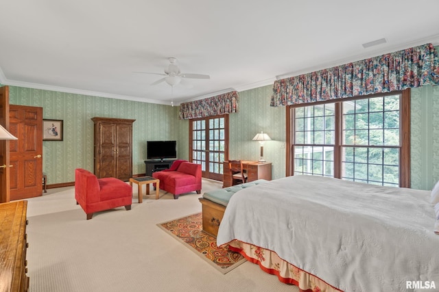 carpeted bedroom featuring ceiling fan and ornamental molding