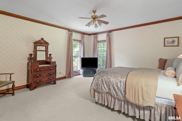 carpeted bedroom featuring ceiling fan and ornamental molding