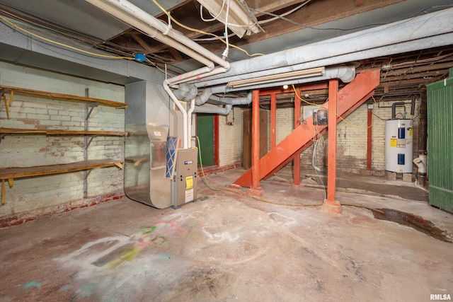 basement featuring electric water heater and heating unit