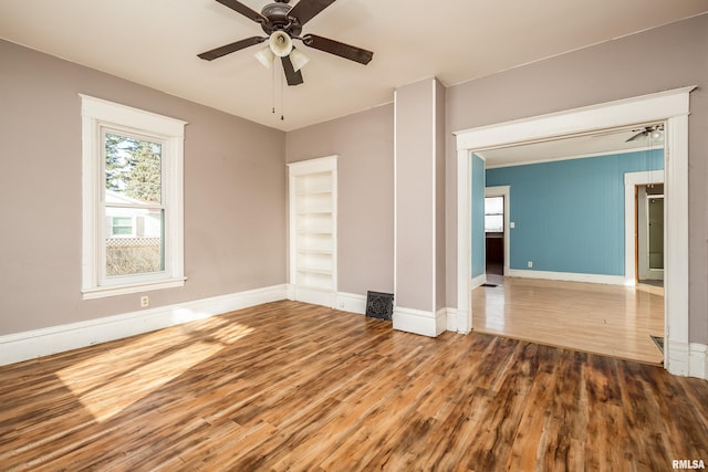 unfurnished room featuring ceiling fan and wood-type flooring