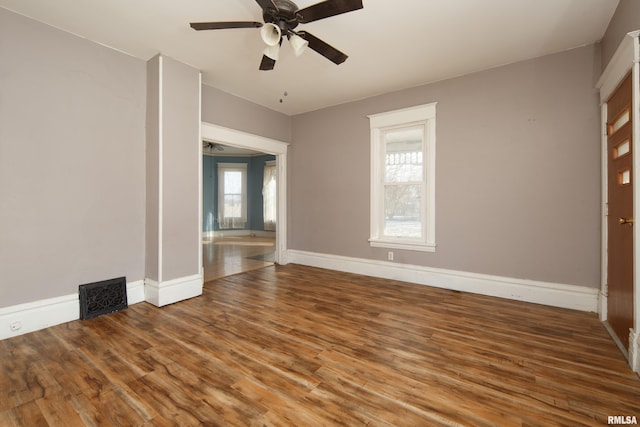 spare room with hardwood / wood-style flooring and ceiling fan