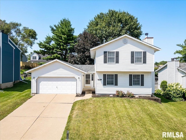 view of front of house with a garage and a front lawn