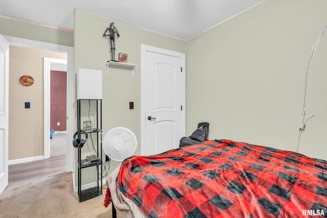 carpeted bedroom featuring crown molding