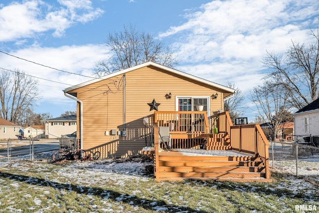 snow covered property featuring a deck