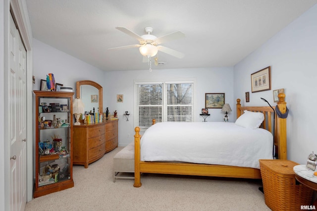 bedroom featuring ceiling fan and a closet