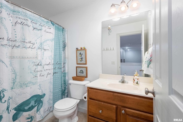 bathroom with tile patterned floors, vanity, toilet, and a shower with shower curtain