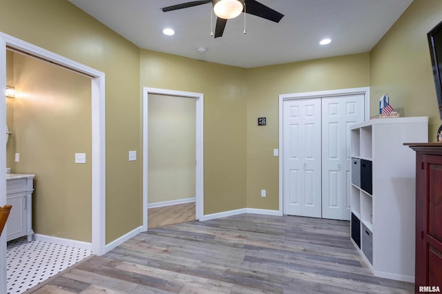 entryway with light hardwood / wood-style floors and ceiling fan