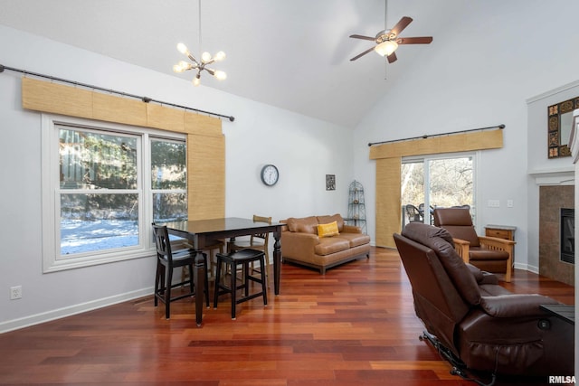 living room with a fireplace, dark hardwood / wood-style floors, and a healthy amount of sunlight