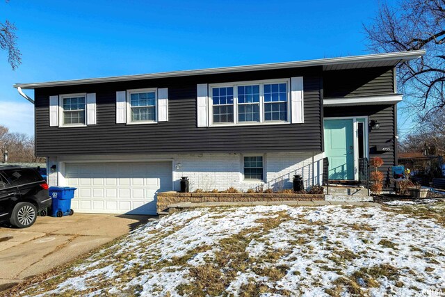 raised ranch featuring a garage