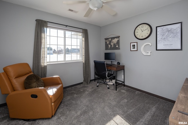 office space with ceiling fan and dark colored carpet