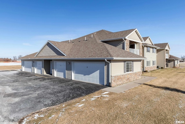 view of side of home with a garage