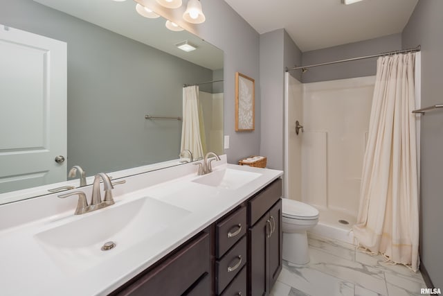 bathroom featuring a shower with curtain, vanity, and toilet