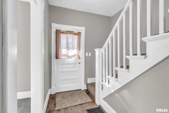 foyer entrance with hardwood / wood-style flooring