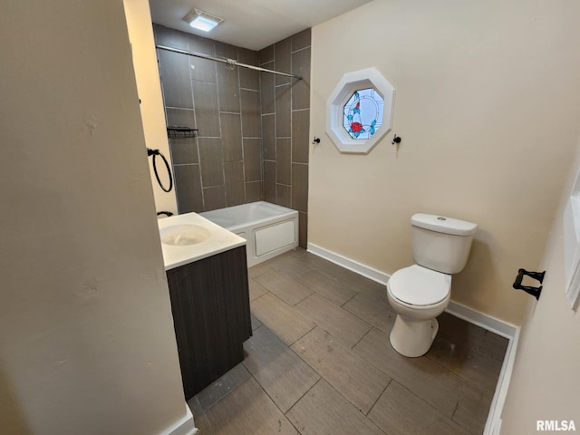 full bathroom with vanity, toilet, and tiled shower / bath