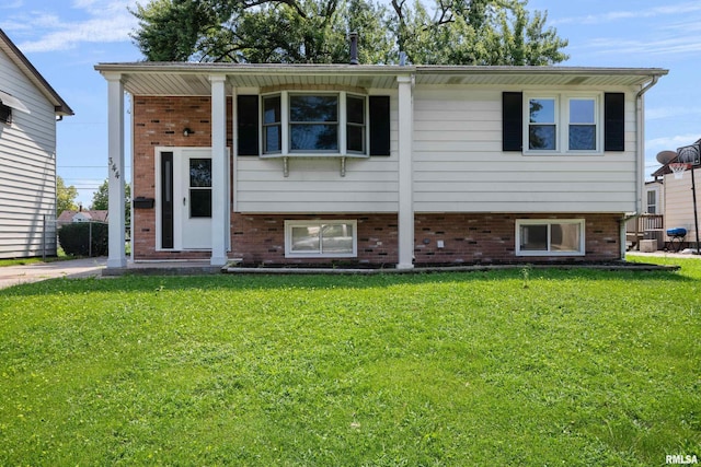 split foyer home with a front lawn