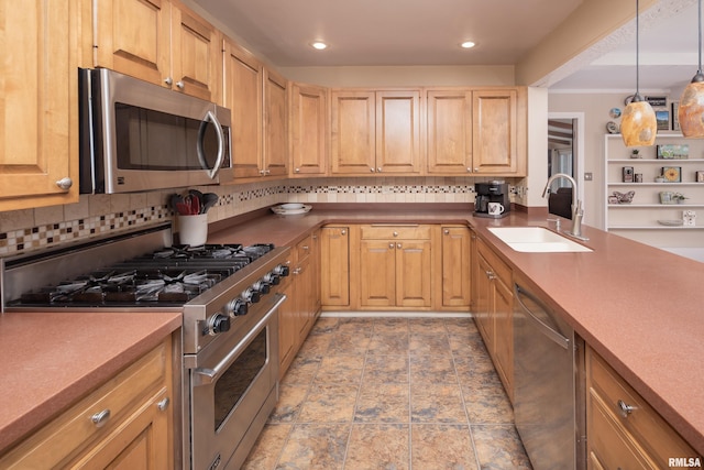 kitchen featuring pendant lighting, sink, appliances with stainless steel finishes, and tasteful backsplash