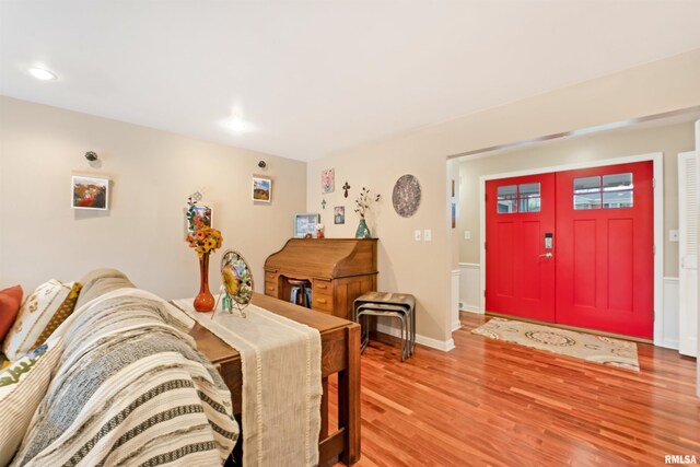 interior space featuring light wood-style flooring, baseboards, and recessed lighting