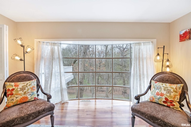 sitting room featuring wood finished floors