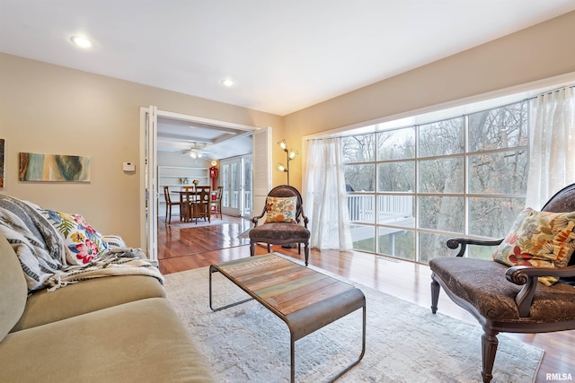 living room with recessed lighting and wood finished floors